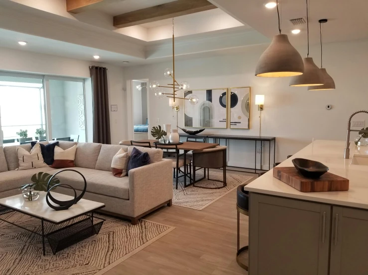 a clean, yet modern living room with a big window