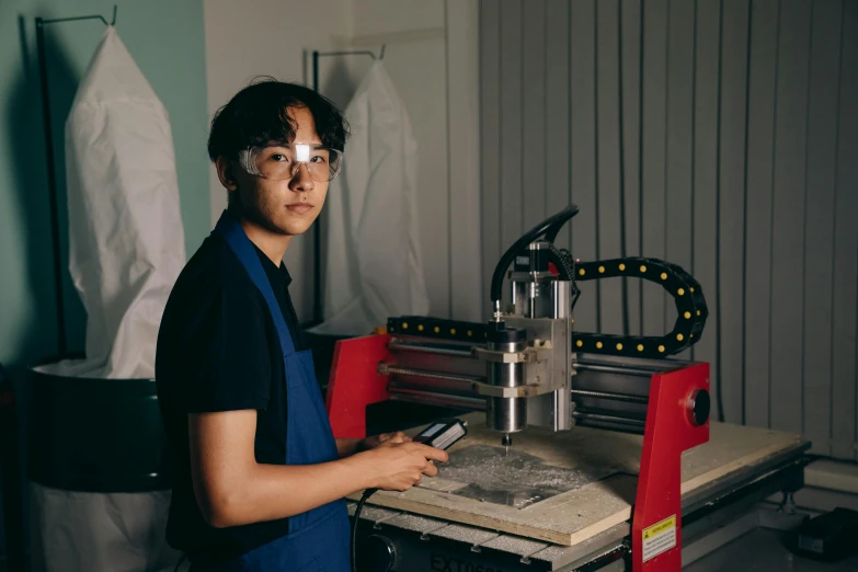 a man standing in front of a machine, darren quach, profile image, high quality portrait, student