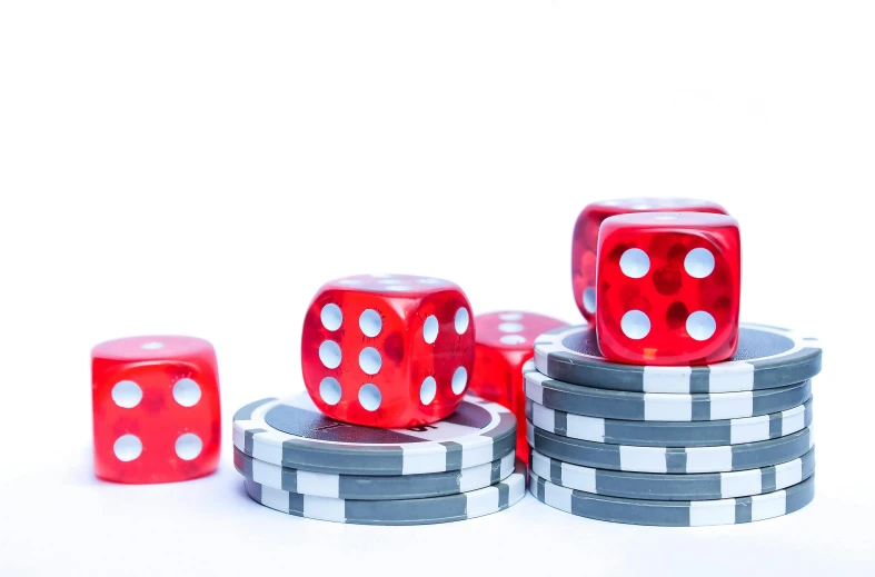 a stack of red dice sitting on top of a pile of black and white chips, pexels, fruit machines, set against a white background, background image, wheel