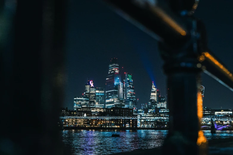 a view of a city at night from a boat, pexels contest winner, london south bank, unsplash 4k, shot on 1 5 0 mm, cinematic view!!!