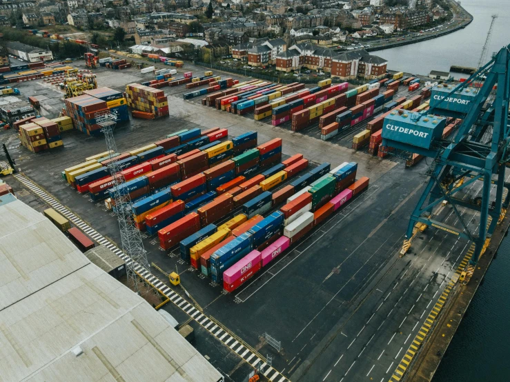 a harbor filled with lots of colorful containers, pexels contest winner, on an empty stage from above, trains in the background, conor walton, high quality product image”