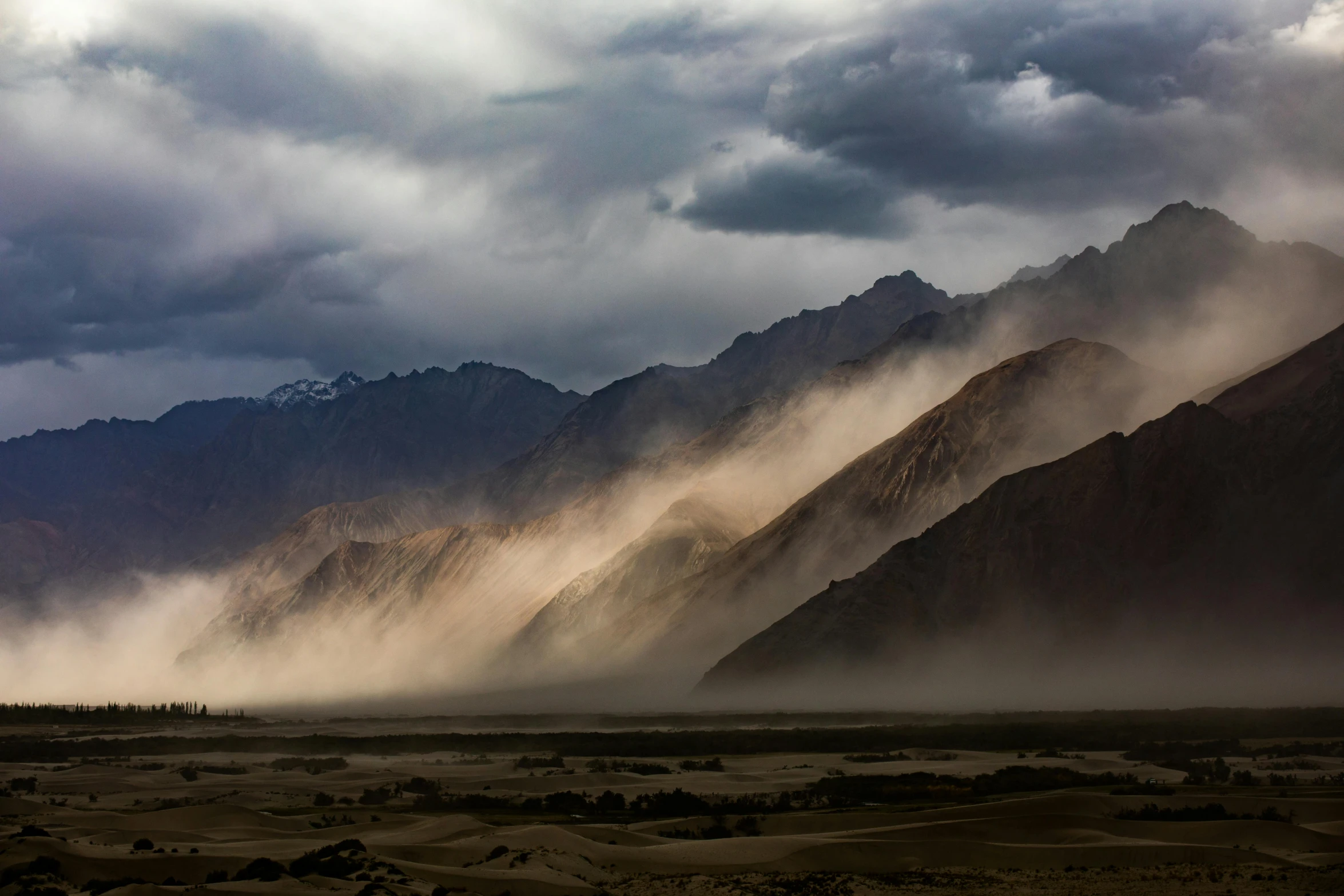 a large mountain covered in lots of fog