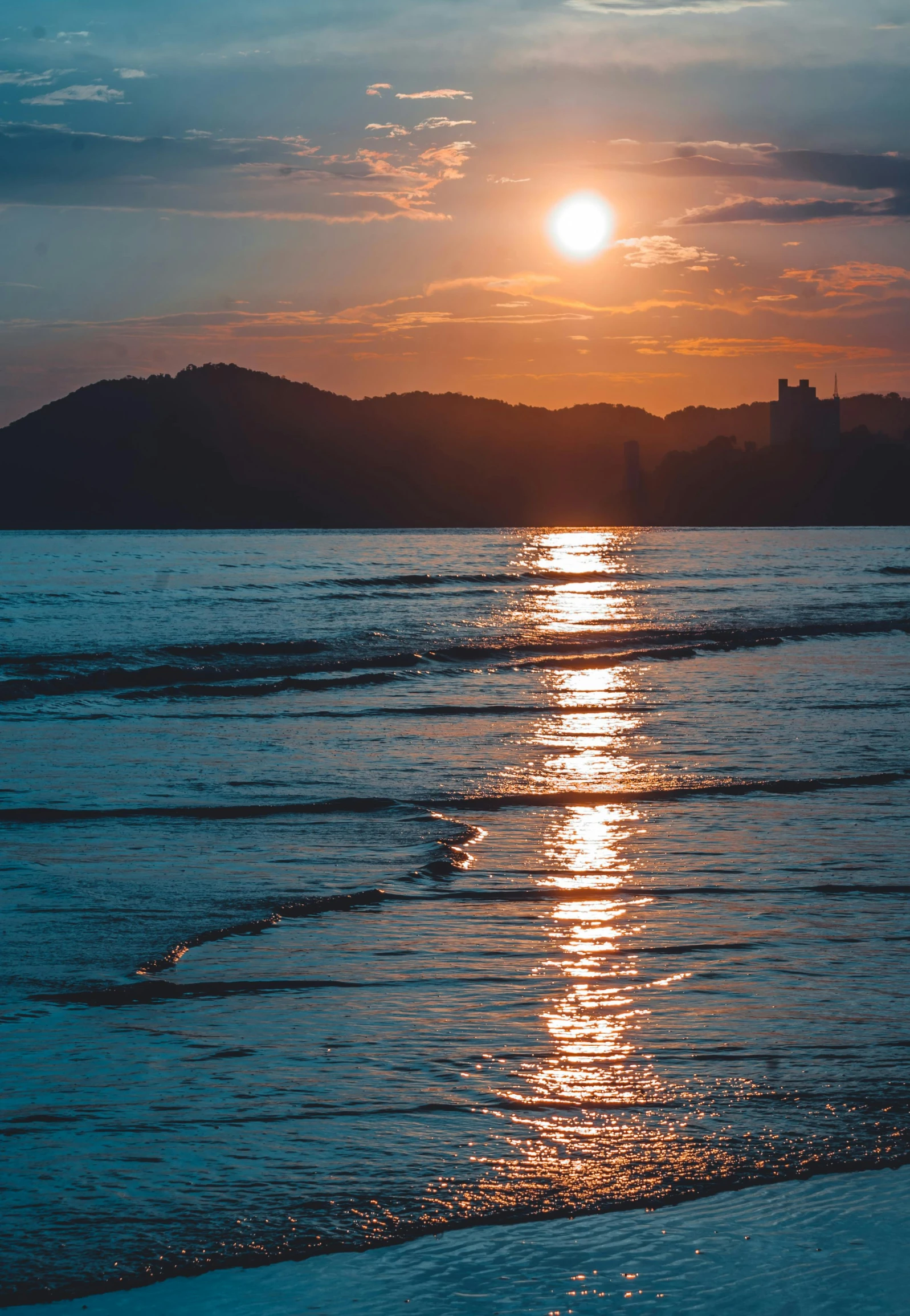 the sun is setting over the water on the beach, a picture, by Tadashi Nakayama, renaissance, golden hour photograph, kamakura scenery, iridescent reflections, myanmar