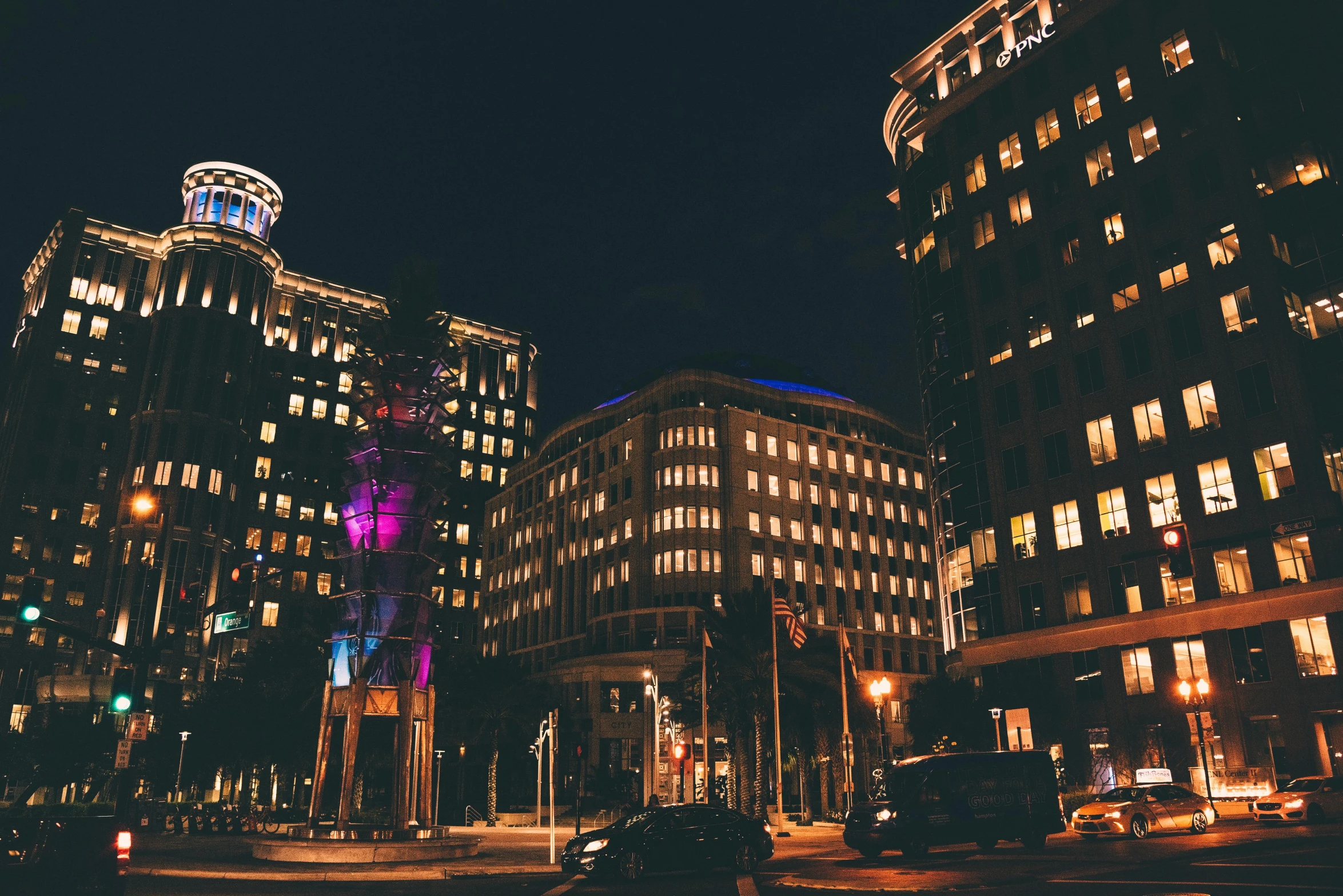 a number of large buildings in a city at night