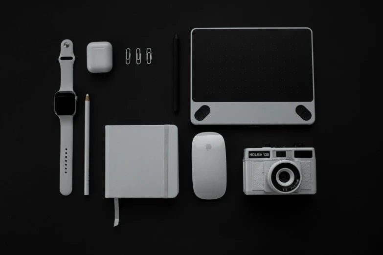 various electronics laid out on a black surface, a black and white photo, unsplash, minimalism, white mouse technomage, monochrome 3 d model, apple design, behance lemanoosh