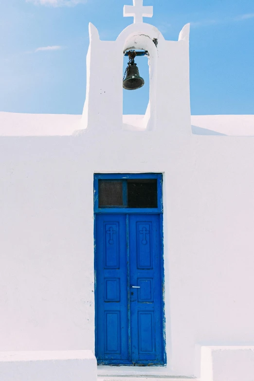 a white church with a blue door and a bell, inspired by Theophanes the Greek, pexels contest winner, square, colors white!!, white sky, electric blue