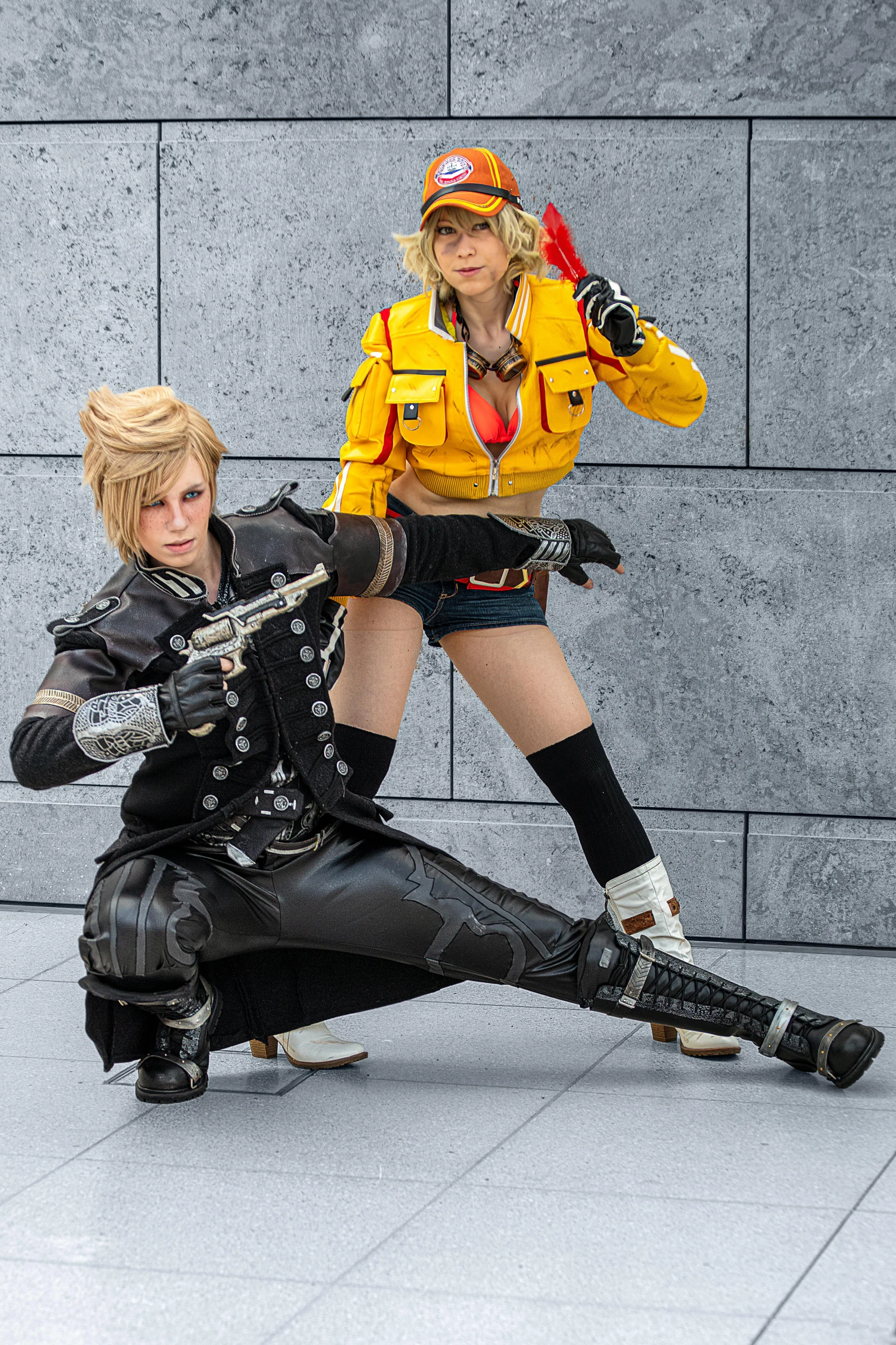 a couple of people standing next to each other, trending on cg society, final fantasy style, black and yellow, cosplay photo, dramatic wielding gun pose