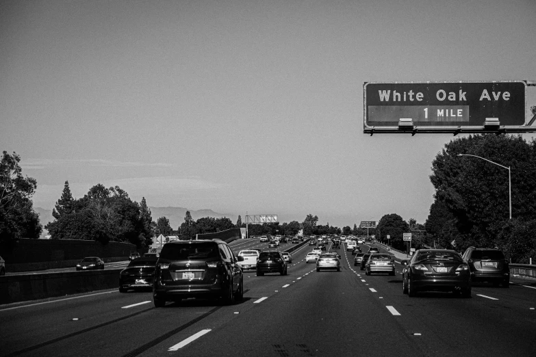 cars drive down an freeway on a clear day