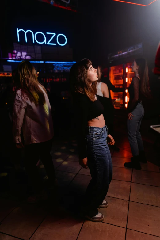 a group of people standing around a pool table, an album cover, trending on unsplash, happening, in a nightclub, chozo, she is dancing, hziulquoigmnzhah