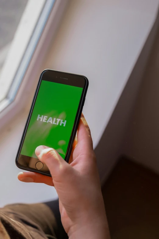 a close up of a person holding a cell phone, by Matthew Smith, health bar hud, green, thumbnail, healthcare