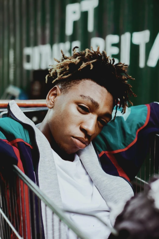 a young man sitting in a shopping cart, an album cover, inspired by David Brewster, trending on pexels, renaissance, ashteroth, headshot profile picture, cords, baggy eyes