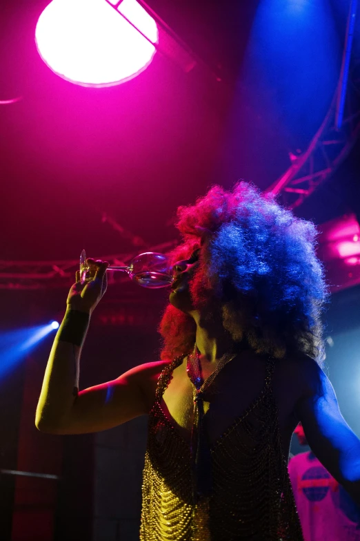 a woman is wearing red hair, holding a trumpet