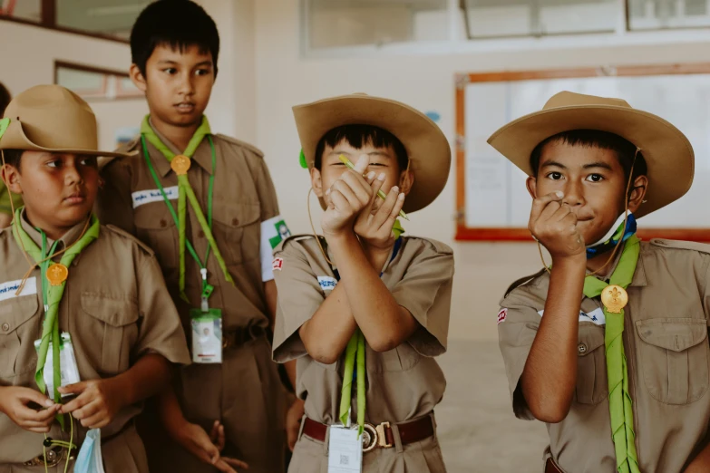 a group of young boys standing next to each other, pexels contest winner, sumatraism, boy scout troop, hand on his cheek, avatar image, thumbnail