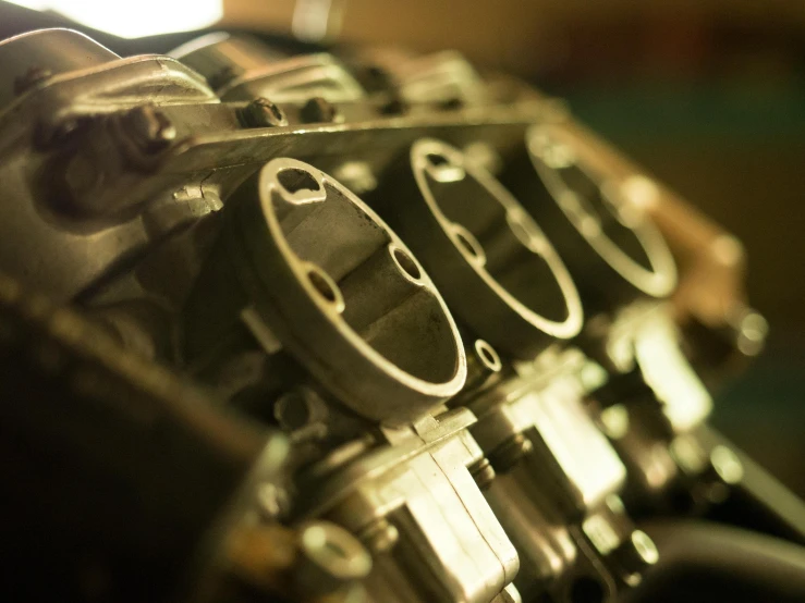 a close up of the engine of a motorcycle, unsplash, art nouveau, leaking pistons, museum quality photo, multi-part, racing