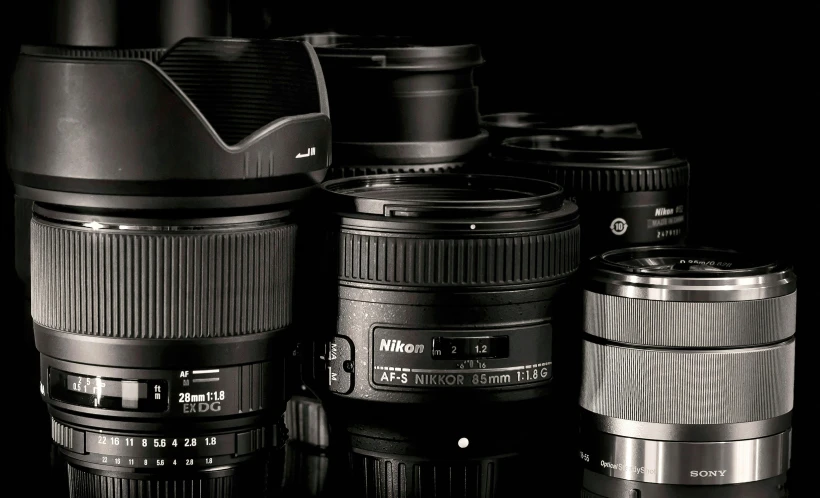 a group of camera lenses sitting next to each other, a picture, nikon photography, sigma 35mm, dramatic product photography, sharp focus high quality