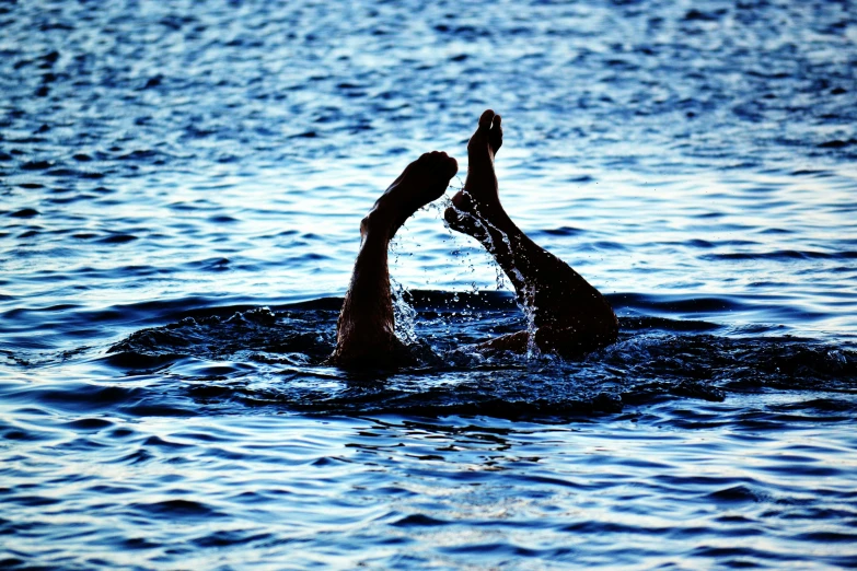 a person swimming in a body of water, by Christen Dalsgaard, hurufiyya, splash image, couple, summer evening, limbs