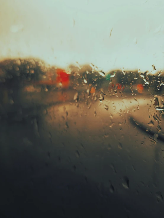 a view out the window of a car in the rain, an album cover, inspired by Elsa Bleda, pexels contest winner, visual art, rain sensor, promo image, crying softly and humbly, concert