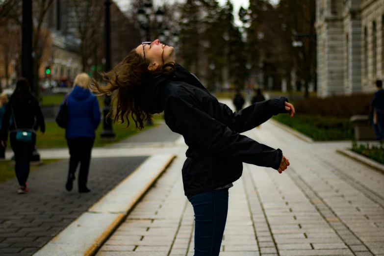 a woman that is standing on a skateboard in the street, by Julia Pishtar, pexels contest winner, happening, excited russians, windy floating hair!!, at a park, dance meditation