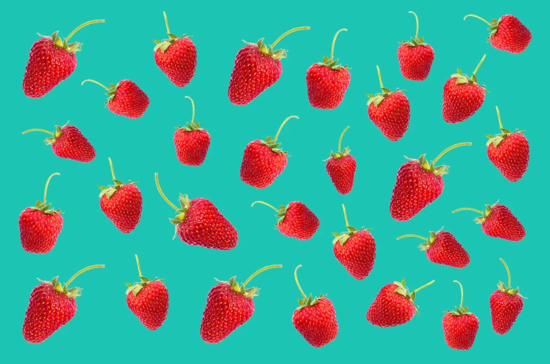 a group of strawberries flying through the air