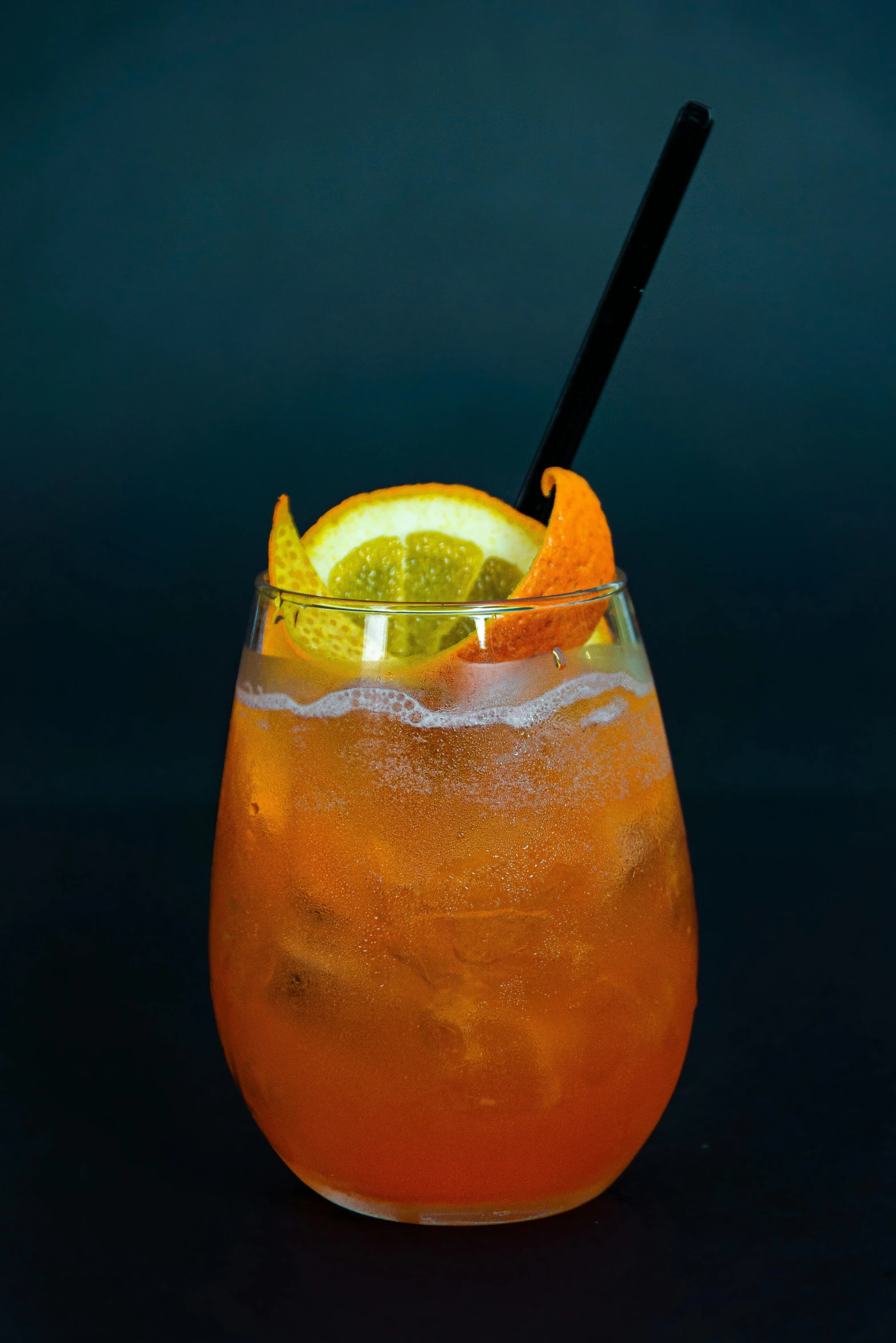 a close up of a drink in a glass with a straw, inspired by Jacopo Bellini, renaissance, gray and orange colours, thumbnail, hurricane, lemon