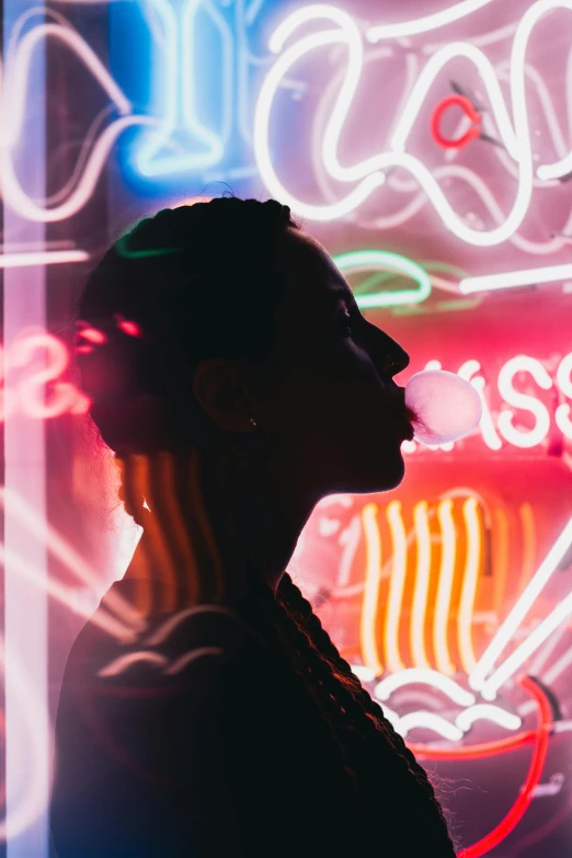 a woman standing in front of a neon sign, pexels contest winner, smoke from mouth, profile image, silhouette of a man, high times magazine aesthetic