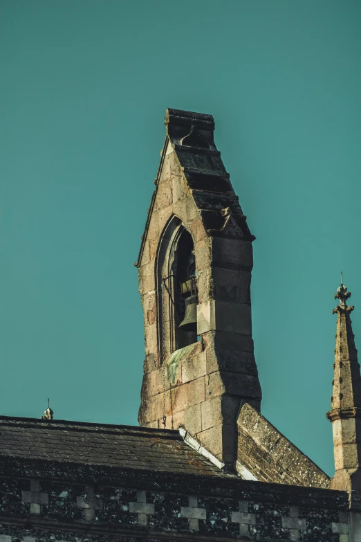 a clock that is on the side of a building, an album cover, by IAN SPRIGGS, pexels contest winner, romanesque, lead - covered spire, blue sky, faded worn, high view