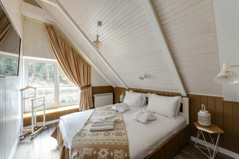 a bedroom with a very large white bed