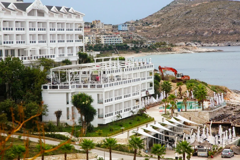 a view of a large building next to a beach