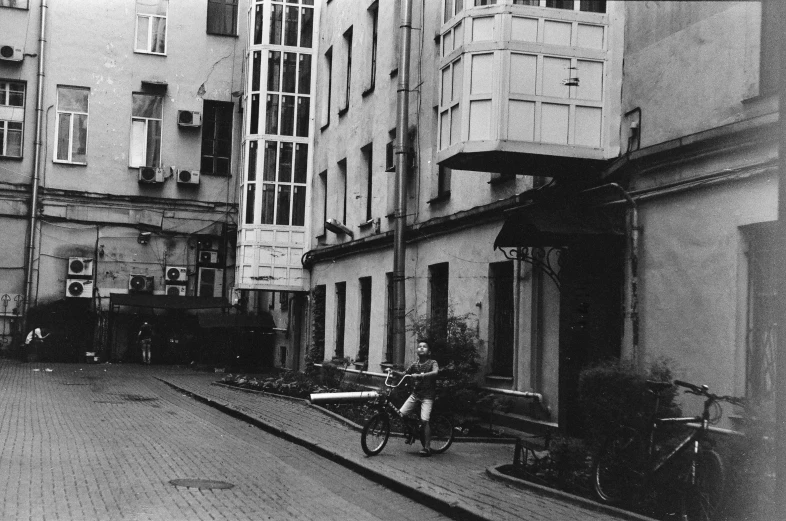 an old street with cars parked on the side