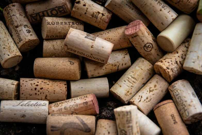 a close up of a pile of wine corks, an album cover, pexels contest winner, thumbnail, fan favorite, brown, robert maplethorpe
