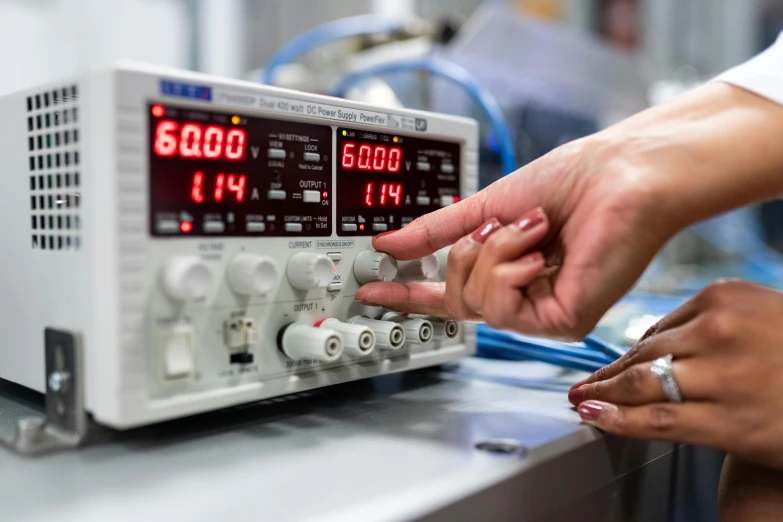 a close up of a person working on a machine, electricity superpowers, stood in a lab, high quality product image”