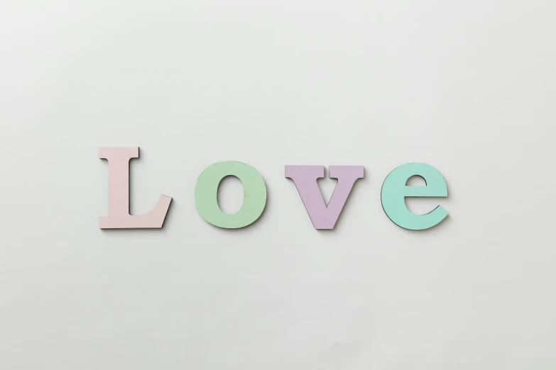 the word love spelled in pastel letters on a white background, by Paul Bird, unsplash, letterism, solid colours material, wall art, 3/4 front view, panels