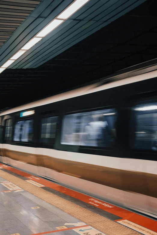 a subway train in motion at the station