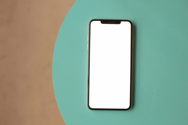 a close up of a cell phone on a table, by Carey Morris, trending on pexels, minimalism, square, rounded, 4 k hd wallpapear, pale green backlit glow