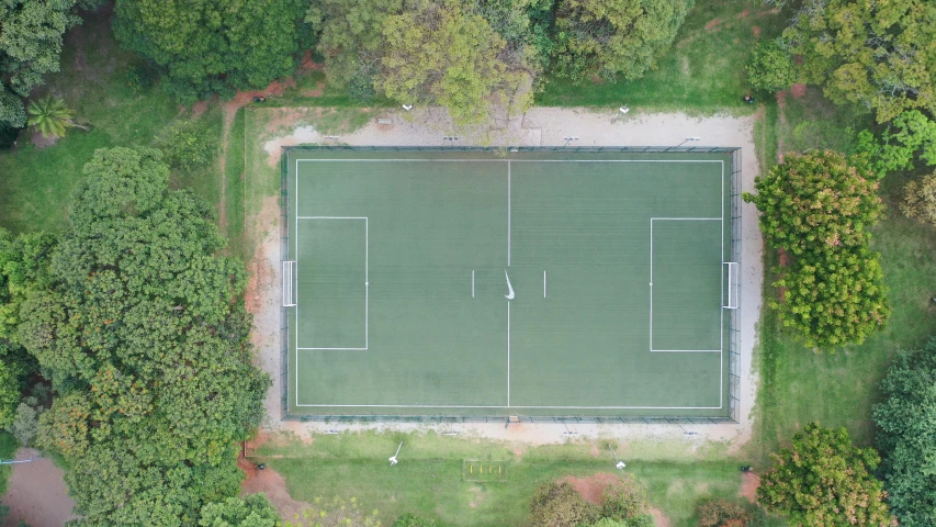 an aerial view of a tennis court surrounded by trees, on a soccer field, são paulo, let's play, rectangle