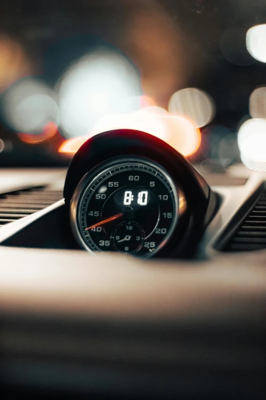 a meter set in close - up next to a dashboard