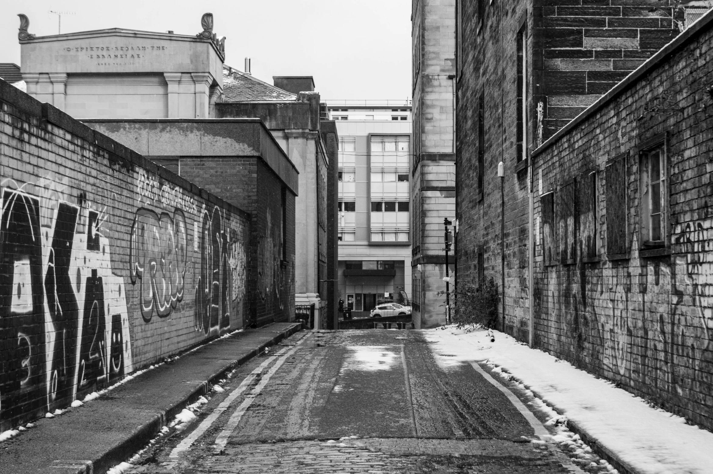 an old street in the city is covered with snow