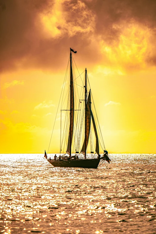 a sailboat in the middle of the ocean at sunset, yellow sky, swashbuckling and romantic, posed, vibrant hues