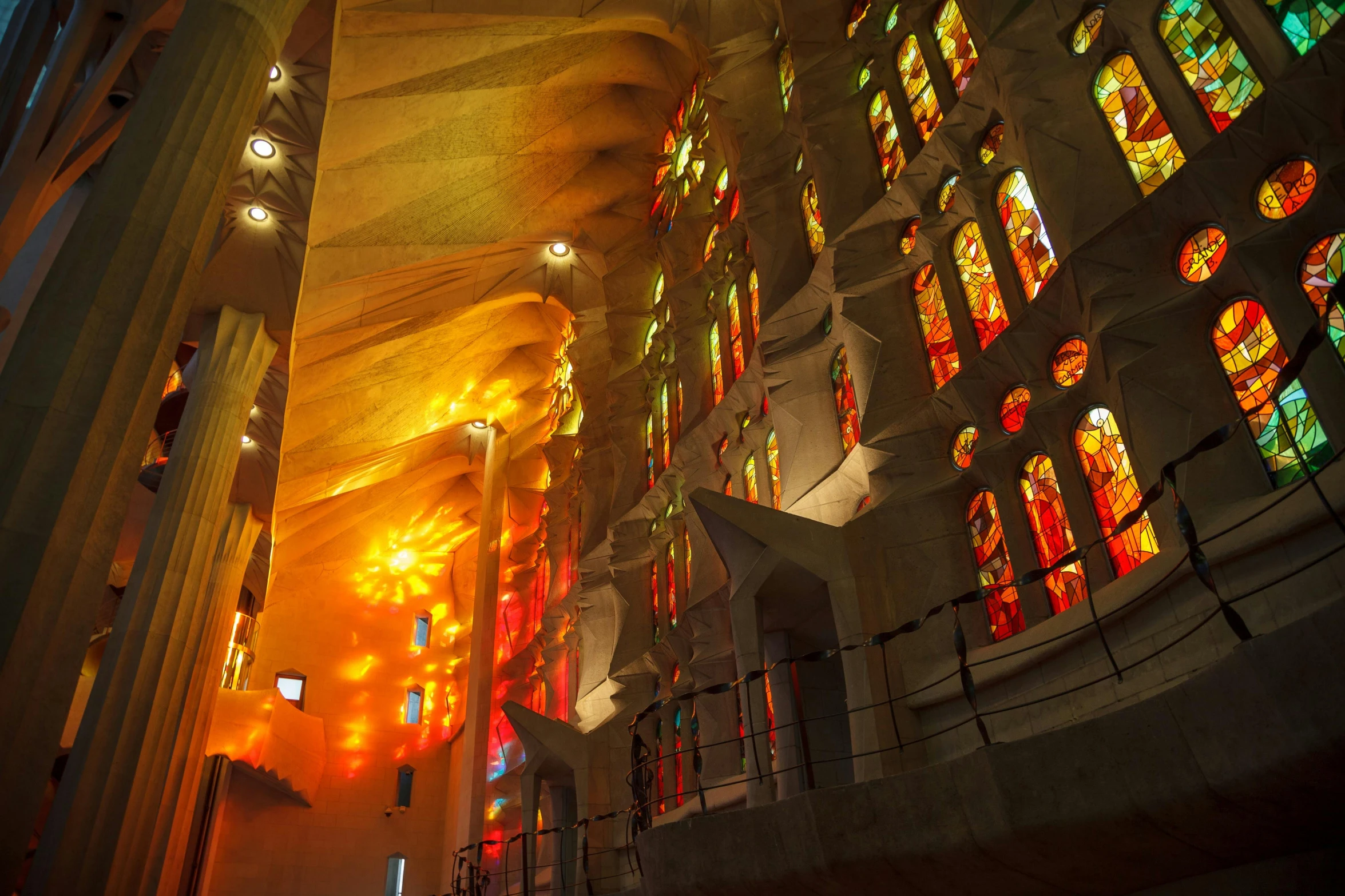 the inside of a church with stained glass windows, a picture, by Gaudi, pexels contest winner, orange and red lighting, frank gehry, profile image, in the center of the image