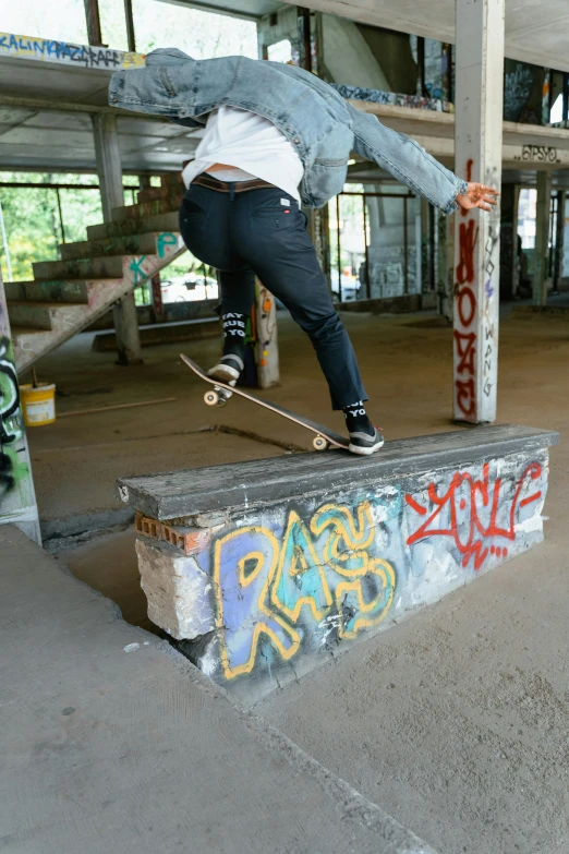 a man flying through the air while riding a skateboard, a picture, graffiti, bench, splash image, denim, emily rajtkowski