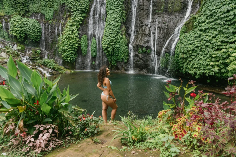 a woman standing in front of a waterfall, les nabis, tropical pool, full body image, festivals, leaked image