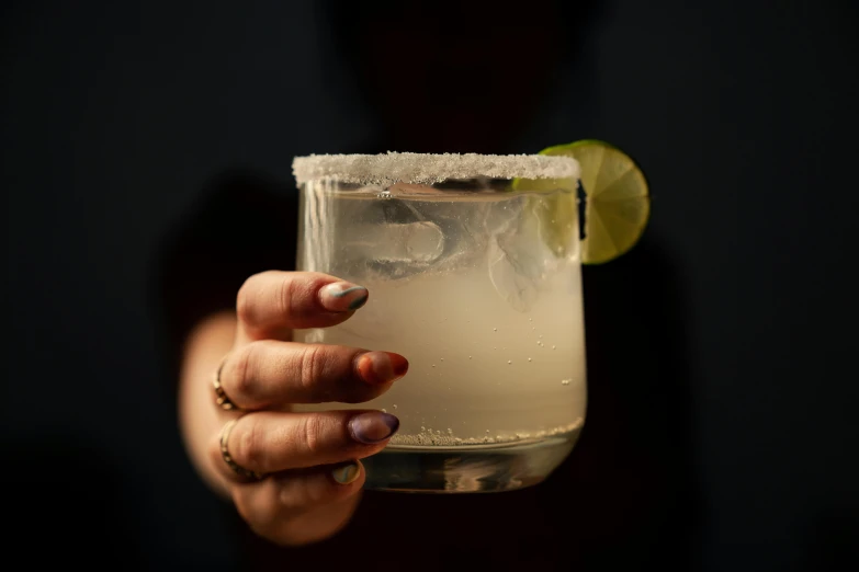 a close up of a person holding a drink, by Carey Morris, square, background image, mexican, item