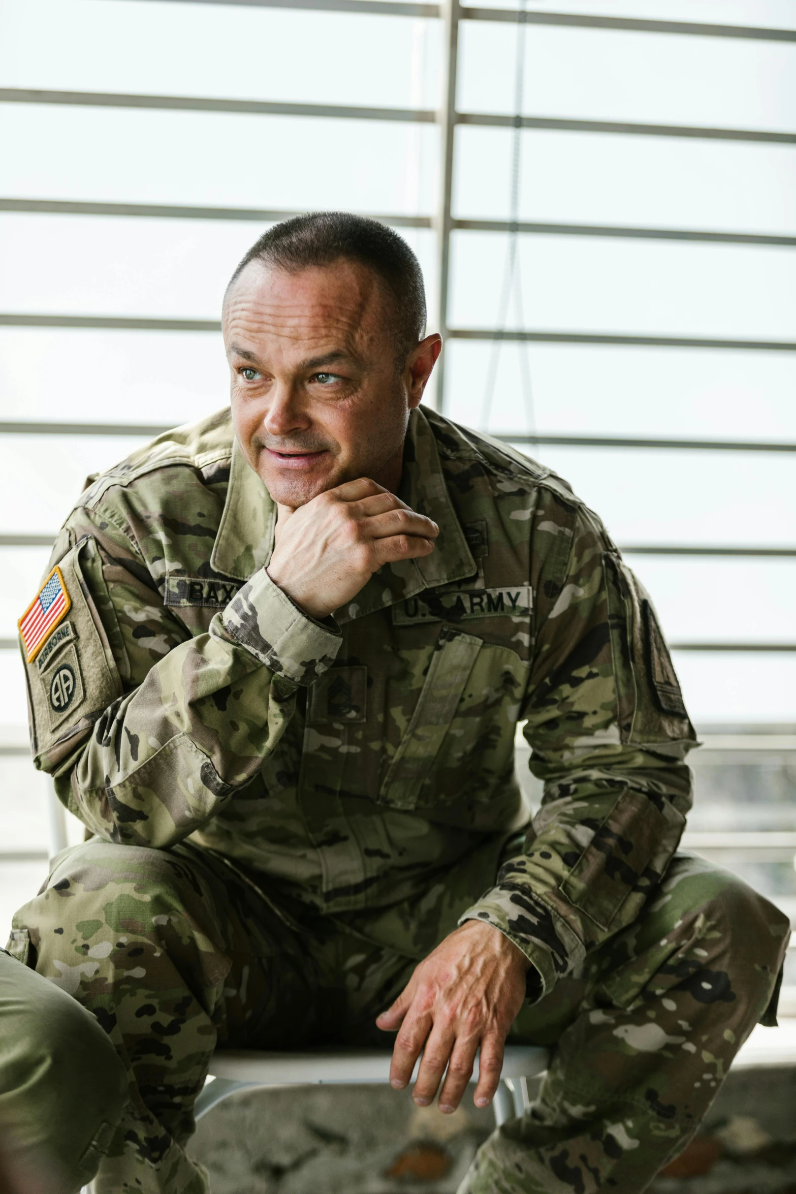 a man in a military uniform sitting on a chair, hbo, chris scalf, profile image, general uniform