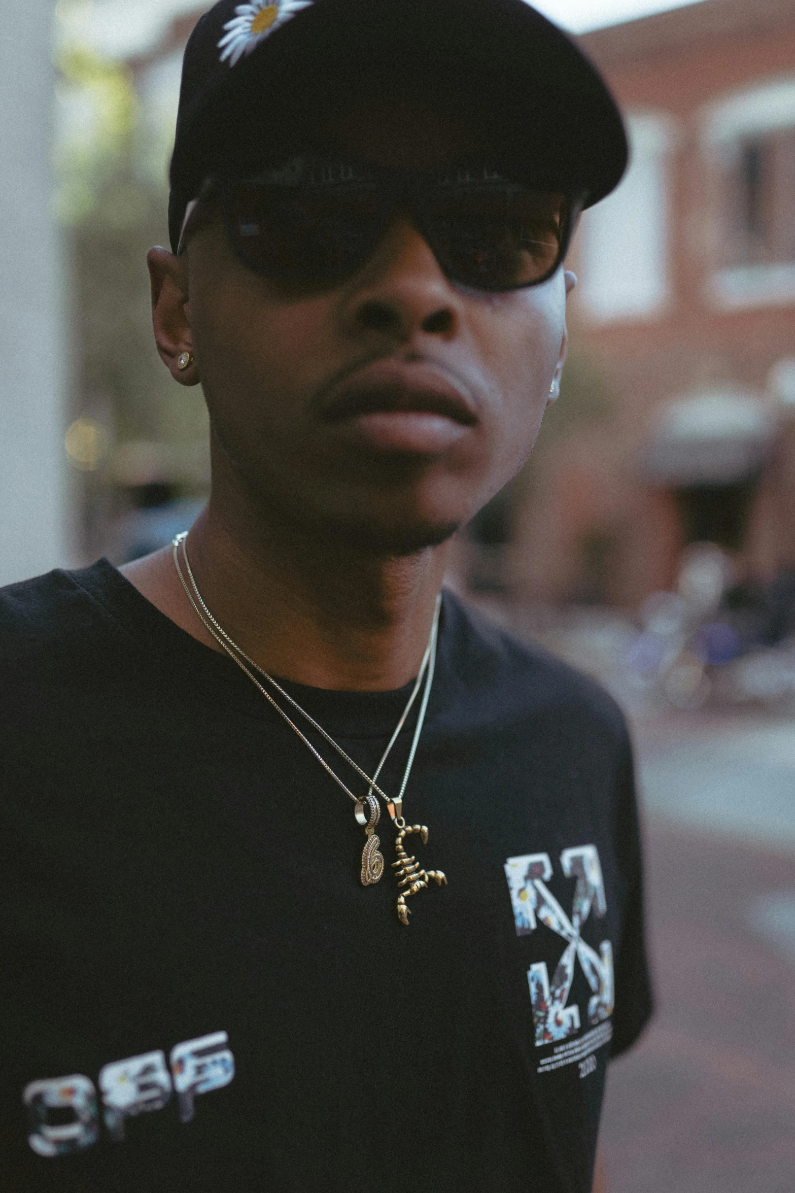 a close up of a person wearing a hat and sunglasses, inspired by Zhu Da, trending on pexels, wears a egyptian ankh necklace, clean shaven, view from the streets, (night)