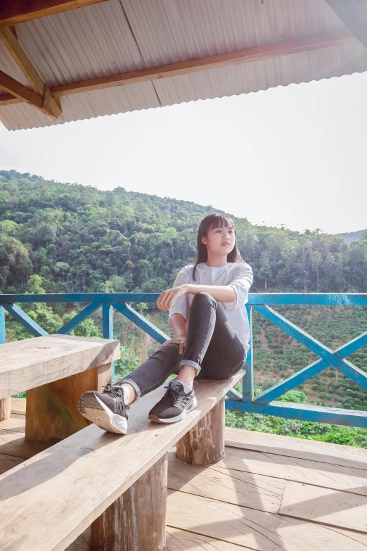 a woman sitting on top of a wooden bench, inspired by Ni Yuanlu, pexels contest winner, sumatraism, teenager hangout spot, outside in a farm, avatar image, tea