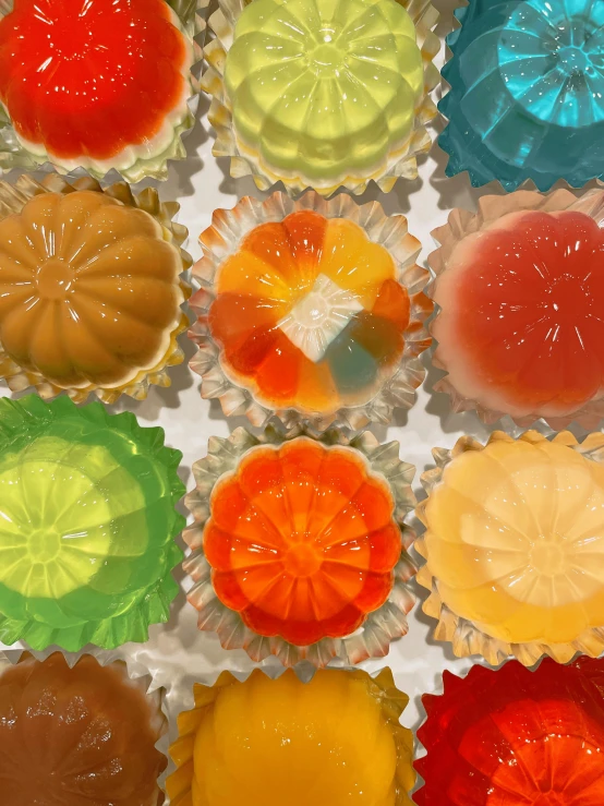 a box filled with lots of different colored candies, by Aileen Eagleton, process art, jelly - like texture. photograph, orange, flan, ilustration