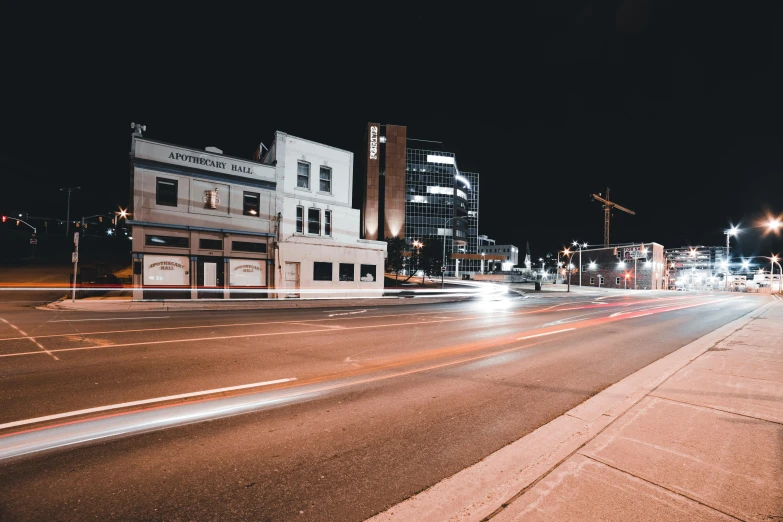 a city street filled with lots of traffic at night, by Andrew Stevovich, unsplash contest winner, visual art, empty streetscapes, winnipeg skyline, taverns nighttime lifestyle, transparent background