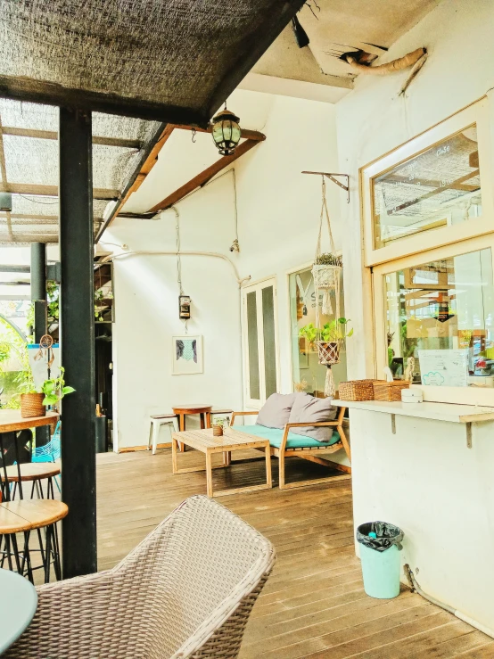 the inside of a restaurant with tables and chairs, unsplash, light and space, vibrant greenery outside, thumbnail, jakarta, low quality photo