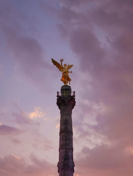 a statue with a bird on top of it, pexels contest winner, berlin secession, mexico, last light, profile image, judy chicago