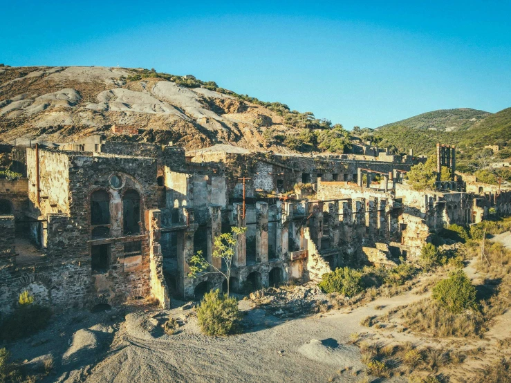 an old abandoned building in the middle of nowhere, pexels contest winner, baroque, ancient mediterranean city, iron smelting pits, las pozas, panoramic